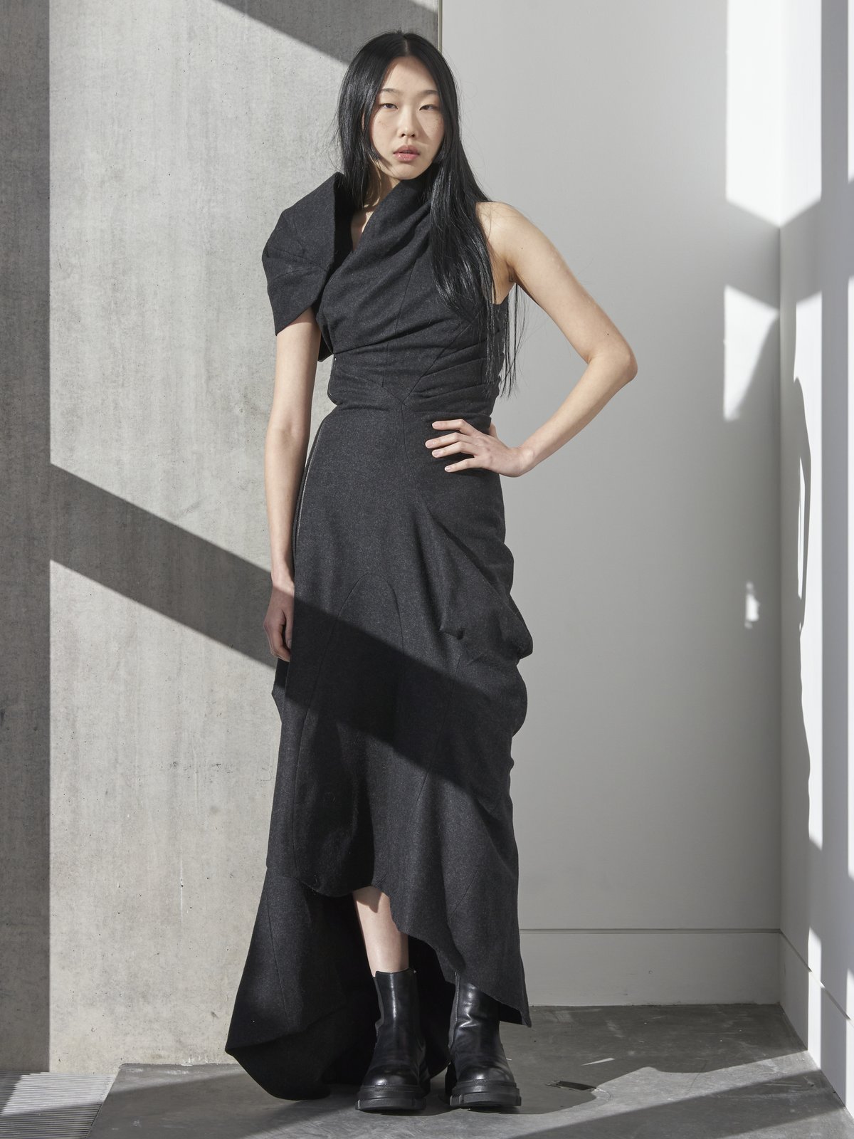 Model in charcoal draped wool dress, mosaic slot two